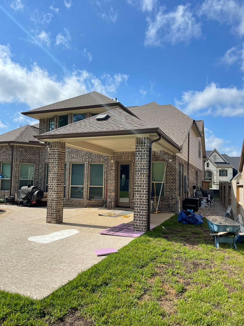 Completed covered patio with stone column bases