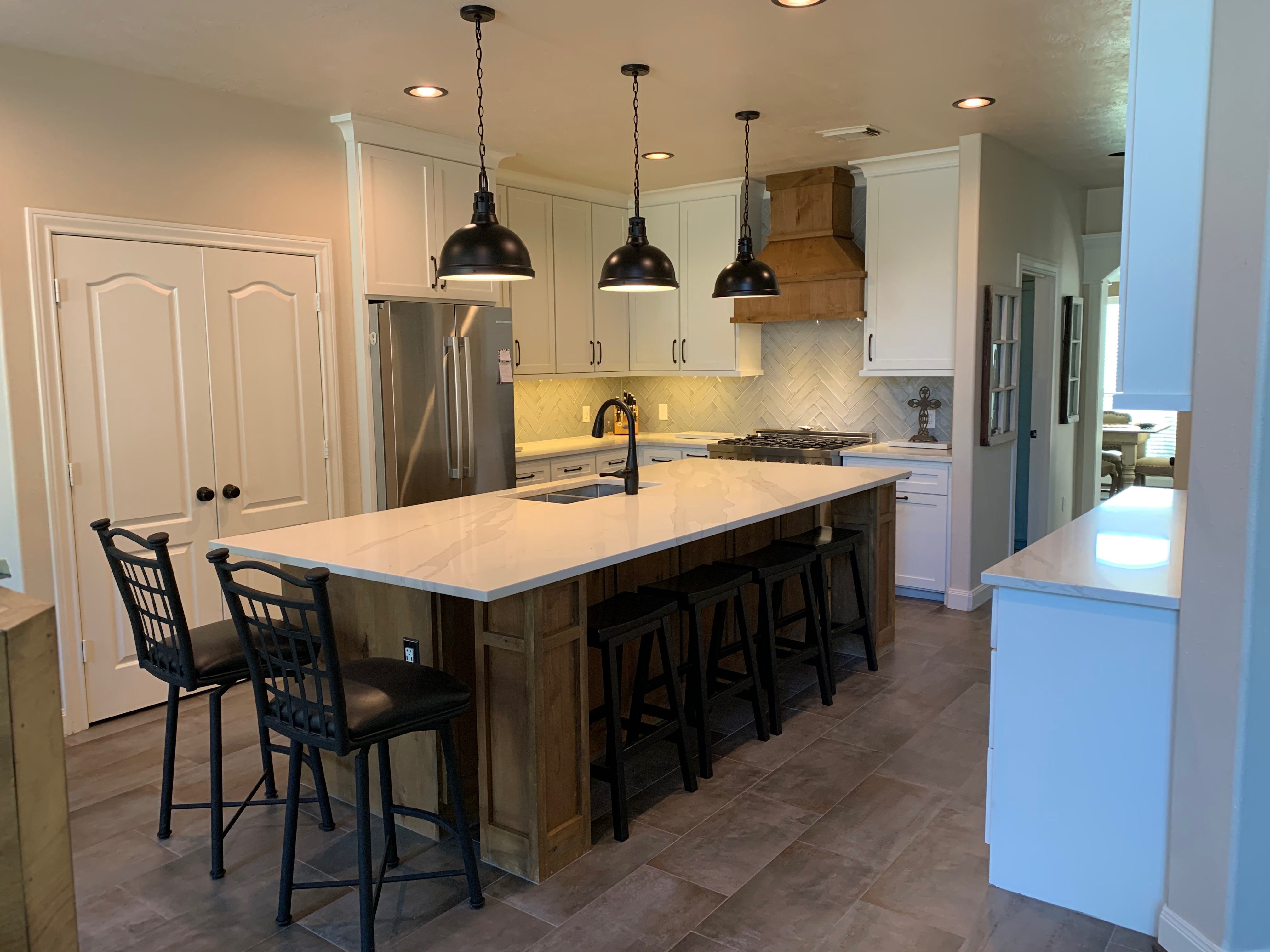 Farmhouse kitchen remodel — white cabinets, wood island, quartz countertops